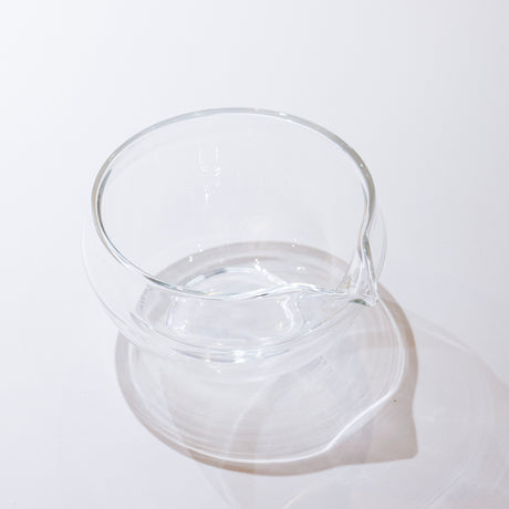 Clear glass pitcher on a white background